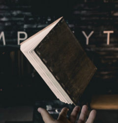 hand with a book in the air