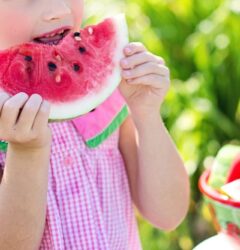 child eating fruit