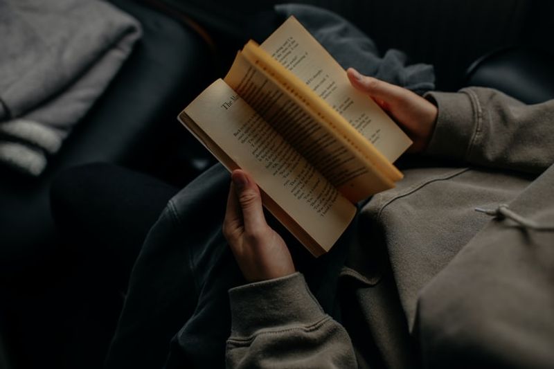 man holding book